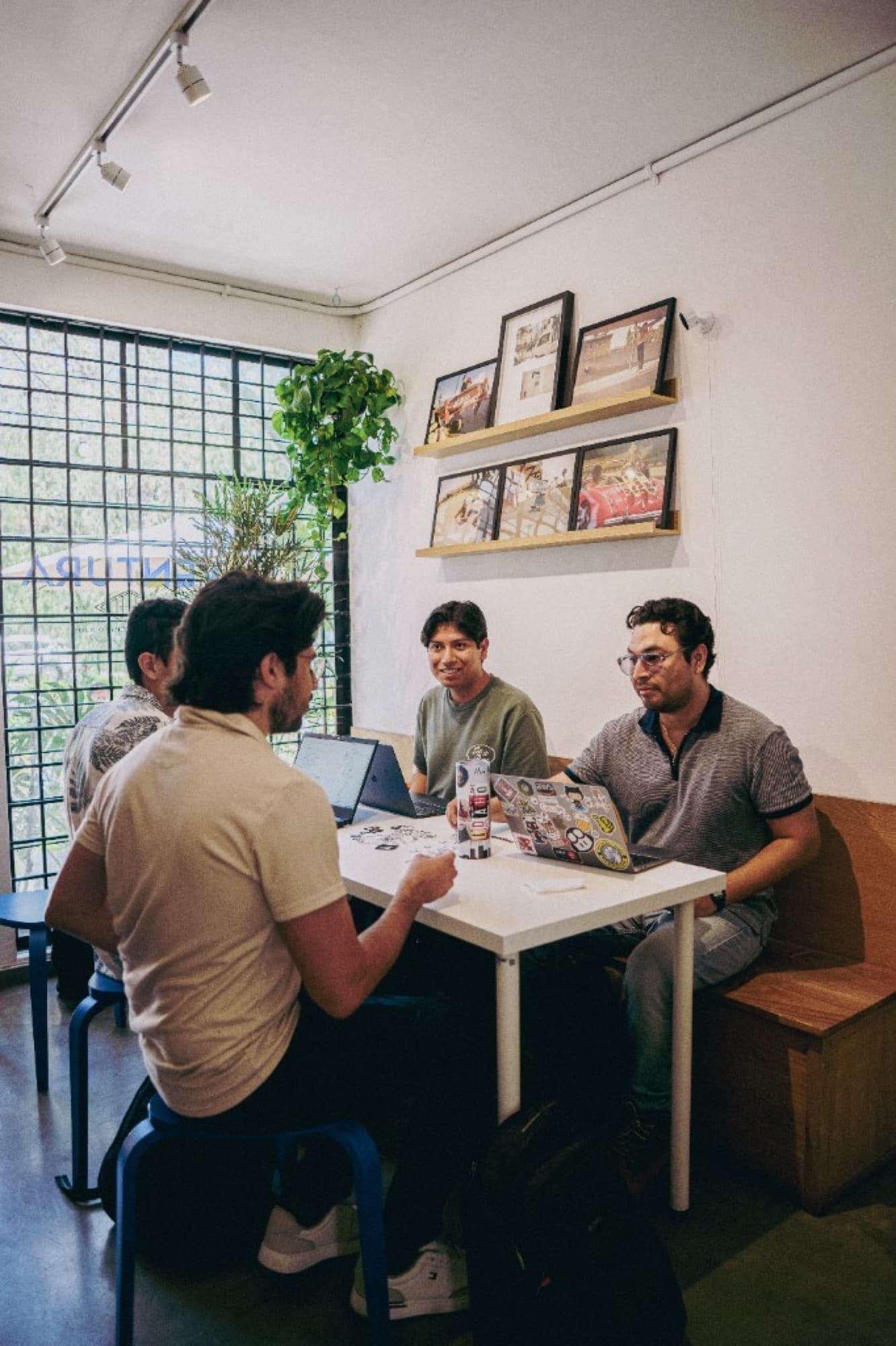 Cursor Guadalajara community collaborating around a table